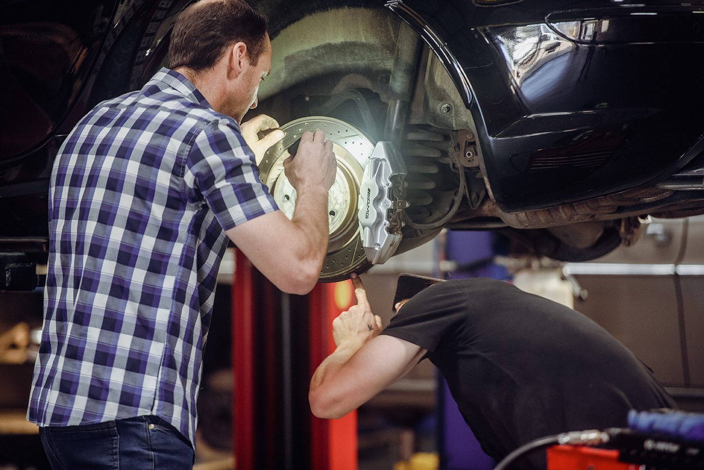 Mechanic working on vehicle